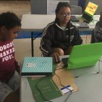 Kids working together in teams to solve the challenge