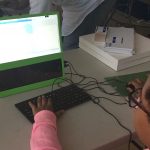 Kid coding animation of bouncing balls.