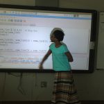 Kid explaining sort algorithms to class.
