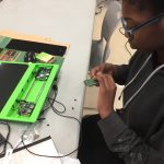 Kid installing prototyping board