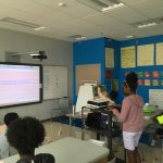 Kid demonstrates her website on Climate Action